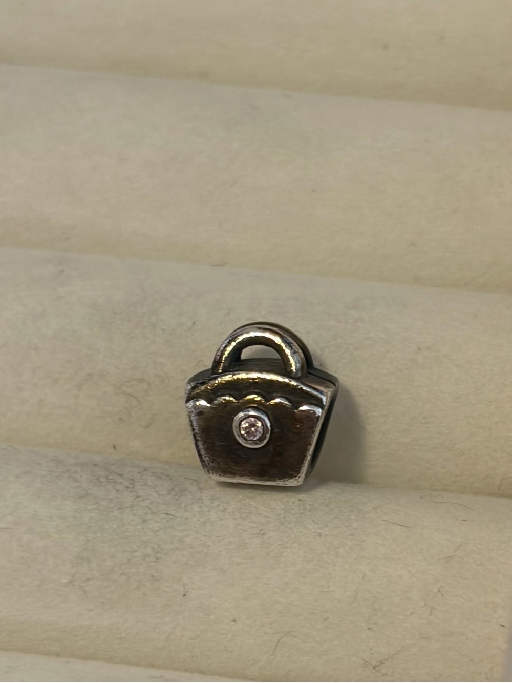Retired Pandora 925 ALE silver purse charm with a pink cubic zirconia stone